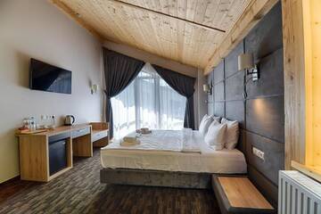 Фото номера Улучшенный полулюкс Отель Karpatski Hotel &amp; Spa г. Буковель 11