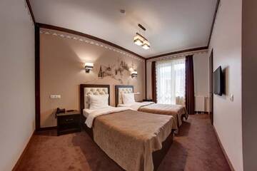 Фото номера Стандартный двухместный номер с 2 отдельными кроватями Отель Karpatski Hotel &amp; Spa г. Буковель 4