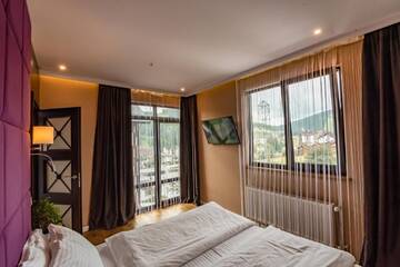 Фото номера Семейный номер с видом на горы Отель F&amp;B Spa Resort (ex. Fomich Hotel) г. Буковель 9