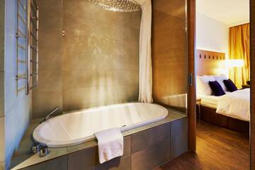 Фото номера Полулюкс Курортные отели Radisson Blu Resort Bukovel г. Буковель 5