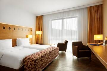 Фото номера Улучшенный номер Курортные отели Radisson Blu Resort Bukovel г. Буковель 2