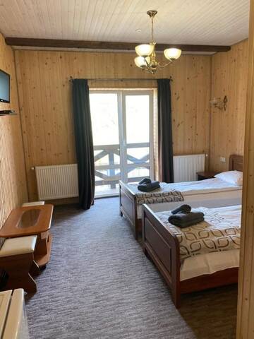 Фото номера Стандартный двухместный номер с 2 отдельными кроватями Отель Villa Loiza г. Буковель 2