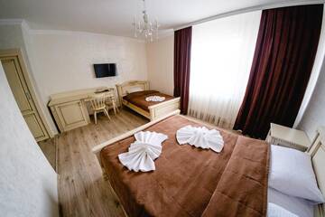 Фото номера Семейный люкс - Включен вход в спа-центр Отель Villa Leku SPA Resort г. Буковель 9