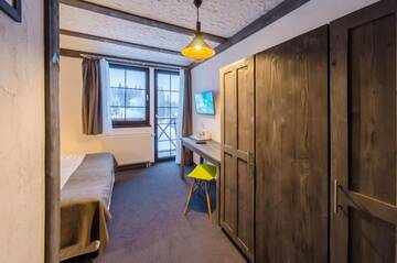 Фото номера Стандартный двухместный номер с 1 кроватью и видом на горы Отель Chalet CrepDeChine Hotel г. Буковель 7