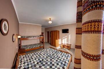 Фото номера Четырехместный номер Отель Hotel Gutsulia г. Буковель 7