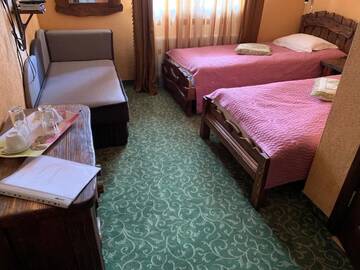Фото номера Стандартный двухместный номер с 1 кроватью или 2 отдельными кроватями Отель Сильверокс г. Буковель 9