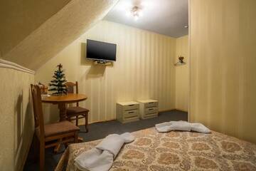 Фото номера Двухместный номер эконом-класса на мансардном этаже Отель Alpin Hotel г. Буковель 7