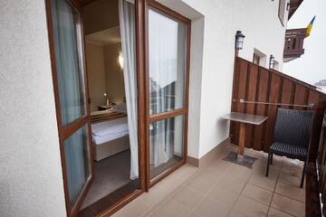 Фото номера Стандартный двухместный номер с 1 кроватью Отель Graal resort г. Буковель 2