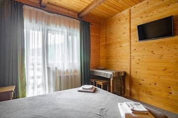 Фото номера Стандартный двухместный номер с 1 кроватью и балконом Отель Arnika Hotel г. Буковель 7