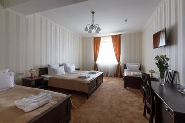 Фото номера Стандартный четырехместный номер Отель GasthauS г. Буковель 4
