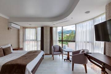 Фото номера Полулюкс с панорамным видом Отель Carparosa Hotel г. Буковель 3