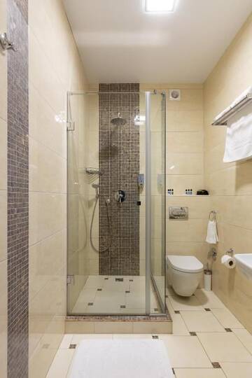 Фото номера Улучшенный двухместный номер с 1 кроватью и балконом Отель Carparosa Hotel г. Буковель 8