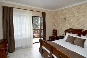 Фото номера Стандартный двухместный номер с 1 кроватью и балконом Отель Carparosa Hotel г. Буковель 9