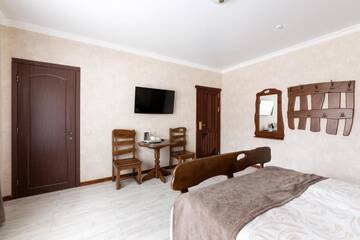 Фото номера Улучшенный двухместный номер с 1 кроватью и балконом Отель Carparosa Hotel г. Буковель 3