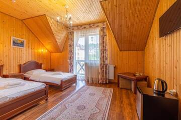 Фото номера Стандартный двухместный номер с 2 отдельными кроватями Отель Hotel Pid Strihoju г. Буковель 8