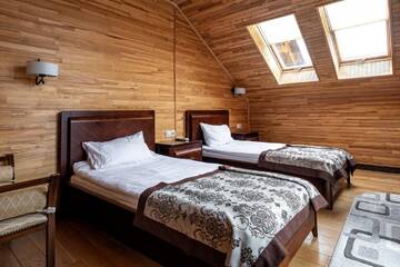 Фото номера Люкс с 2 спальнями и балконом Отель Chalet du Mont г. Буковель 2