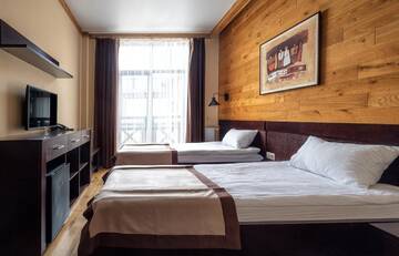 Фото номера Двухместный номер с 2 отдельными кроватями и балконом Отель Chalet du Mont г. Буковель 3
