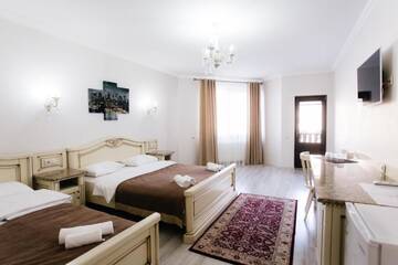 Фото номера Стандартный четырехместный номер Отель Diamond Resort White г. Буковель 3