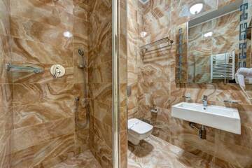 Фото номера Суперлюкс с 2 спальнями, посещение спа-центра Отель Hotel Podgore Spa &amp; Resort г. Буковель 11
