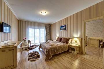 Фото номера Суперлюкс с 2 спальнями, посещение спа-центра Отель Hotel Podgore Spa &amp; Resort г. Буковель 10
