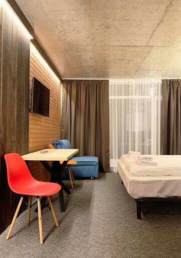 Фото номера Улучшенный номер с кроватью размера «king-size» Отель Loft Hotel г. Буковель 2