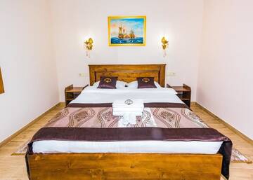 Фото номера Стандартный двухместный номер с 1 кроватью и балконом Отель Villa Livorno г. Буковель 3
