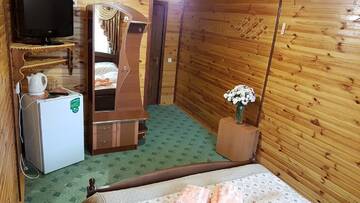 Фото номера Улучшенный номер с кроватью размера «king-size» Гостевой дом Sadyba u Halyny Sunrise г. Буковель 5