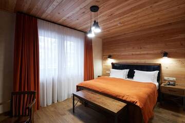 Фото номера Улучшенный двухместный номер с 1 кроватью Отель Ганц &amp; Spa г. Буковель 22