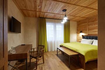Фото номера Улучшенный двухместный номер с 1 кроватью Отель Ганц &amp; Spa г. Буковель 7