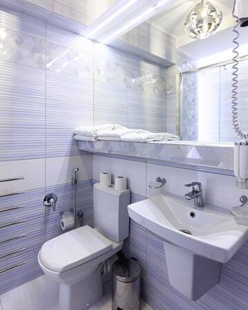Фото номера Трехместный номер с балконом Отель Hotel SKI Lift 7 г. Буковель 7