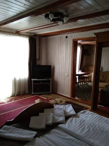 Фото номера Люкс с балконом Отель Dovbushanka Hotel in Bukovel г. Буковель 7